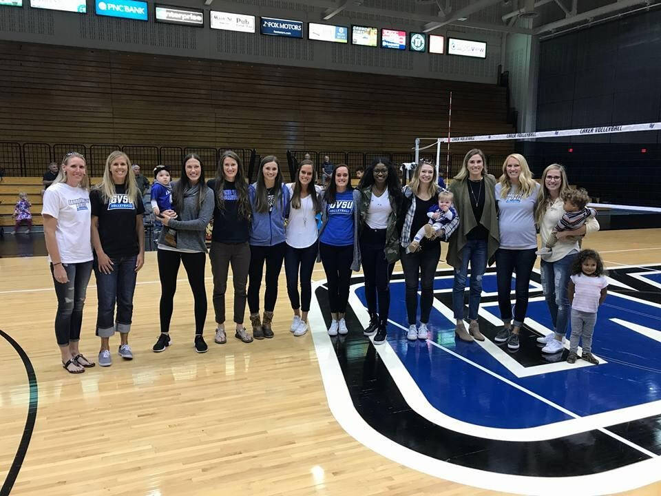 A group of women and children at the GVSU Basketball court